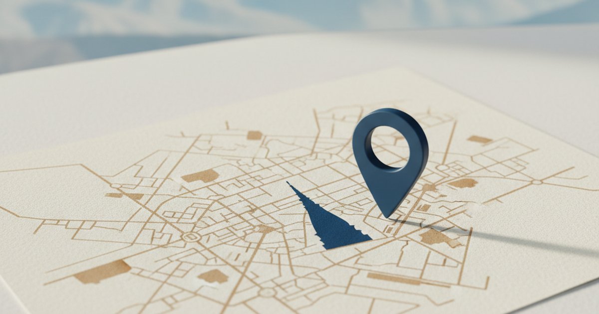 Mappa stilizzata di Torino con la Mole Antonelliana e le Alpi sullo sfondo e un segnaposto blu sulla città